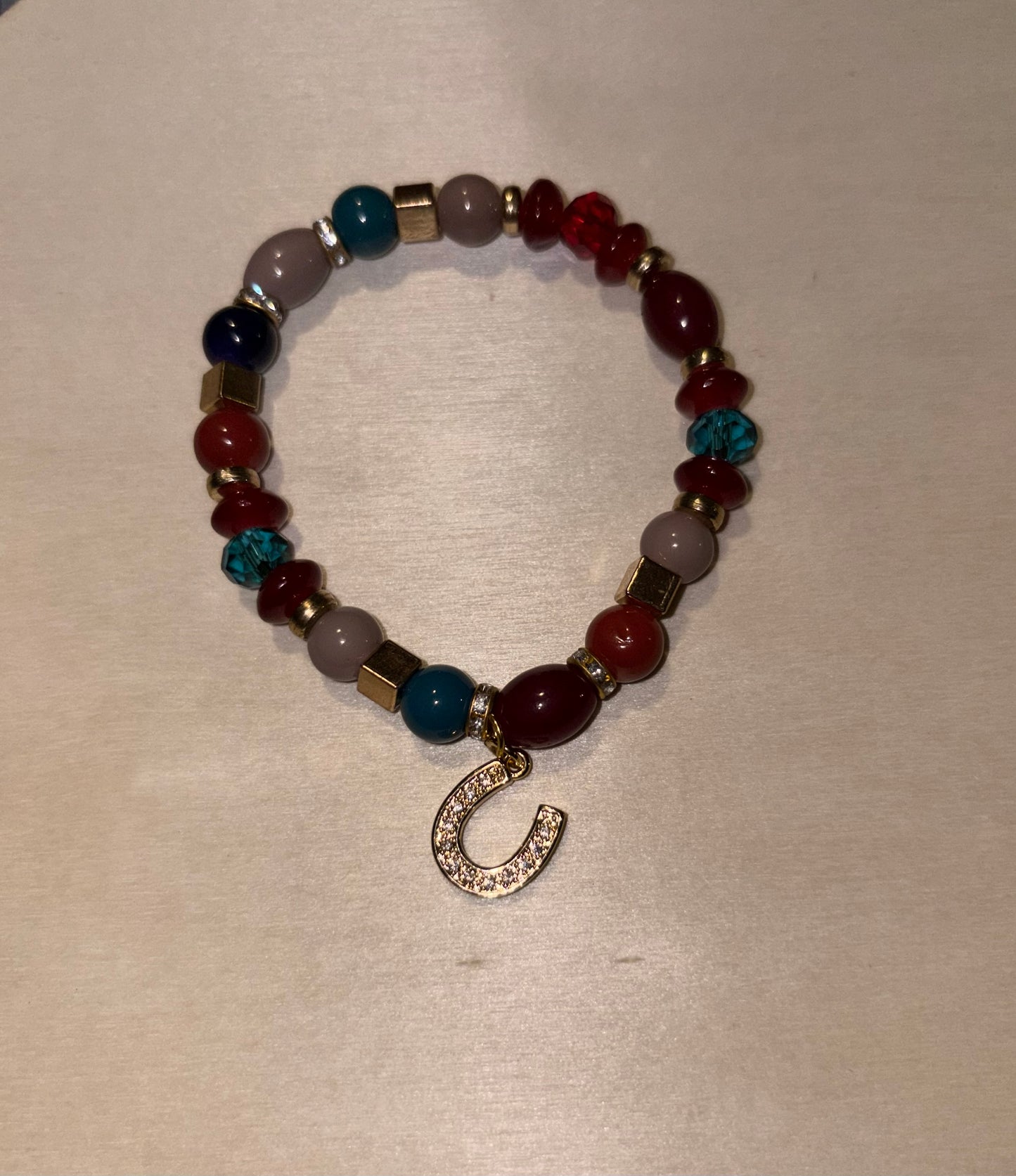 Handcrafted bracelet with horseshoe charm