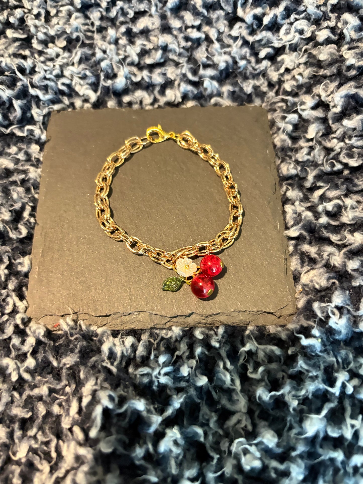 Gold bracelet with camellia flower