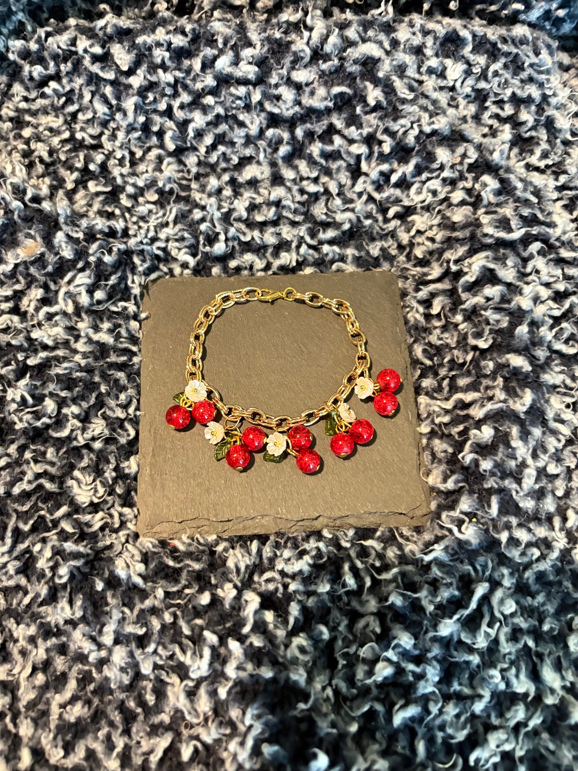 Gold bracelet with camellia flower